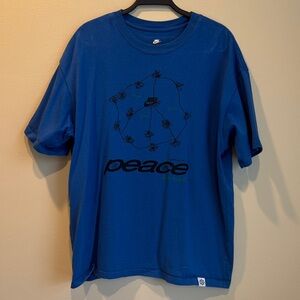 Nike Men's Peace Graphic Tee in Blue